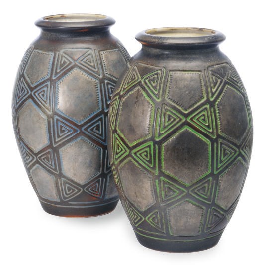 A PAIR OF FRENCH EARTHENWARE VASES MOLDED WITH A GEOMETRIC PATTERN,