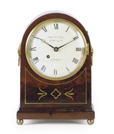 A REGENCY BRASS-INLAID MAHOGANY MANTELCLOCK,