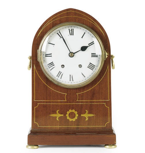 AN EDWARDIAN BRASS-INLAID MAHOGANY MANTELCLOCK,