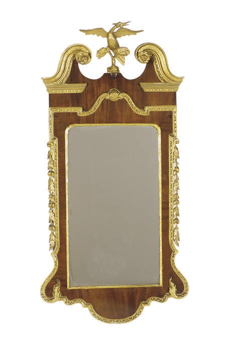A GEORGE II PARCEL-GILT MAHOGANY LOOKING GLASS,