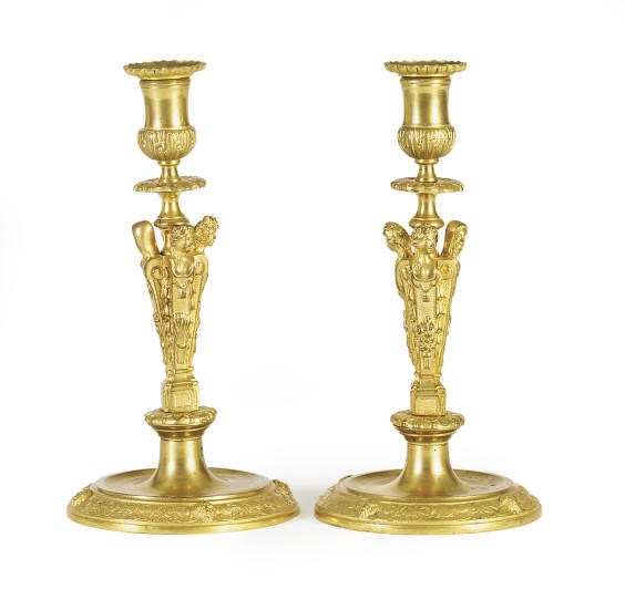 A PAIR OF GILT-BRONZE FIGURAL CANDLESTICKS,
