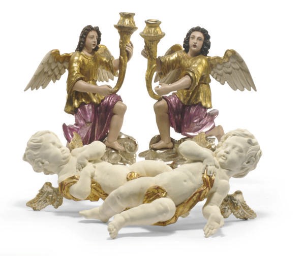 A PAIR OF CONTINENTAL PAINTED AND PARCEL-GILT FIGURAL CANDLESTICKS,