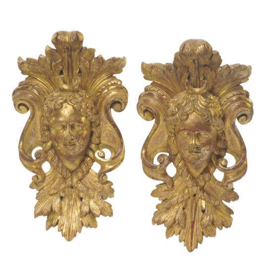 A PAIR OF FRENCH GILTWOOD MASK APPLIQUES,