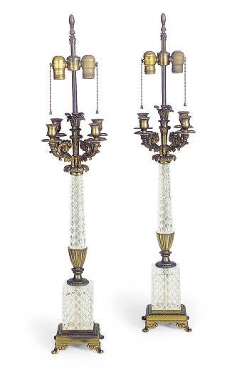 A PAIR OF GILT-METAL MOUNTED CUT-GLASS FOUR-LIGHT CANDELABRA,