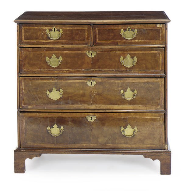 AN ENGLISH WALNUT AND FEATHER-BANDED CHEST-OF-DRAWERS,