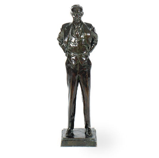 A PATINATED BRONZE FIGURE OF FLOYD B. OLUM,