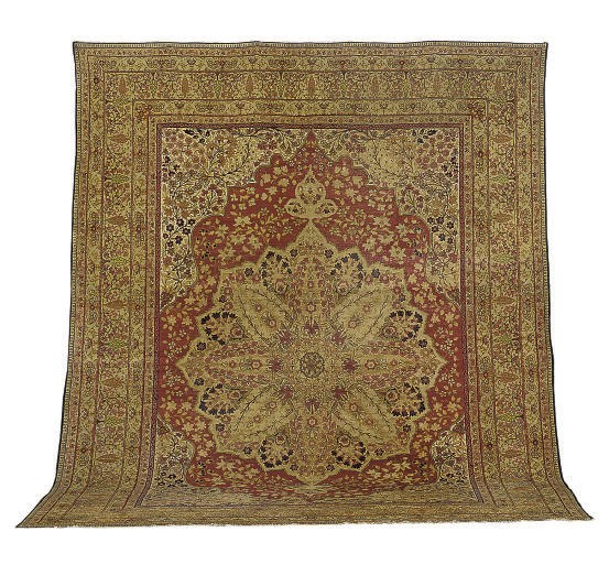 A KIRMAN CARPET,