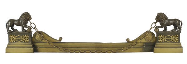 A FRENCH EMPIRE PATINATED AND GILT-BRONZE FIGURAL FIRE FENDER,