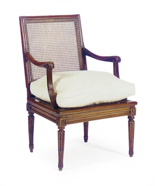 A LOUIS XVI WALNUT AND CANED FAUTUEIL,