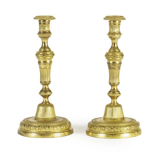 A PAIR OF LOUIS XVI ORMOLU CANDLESTICKS,