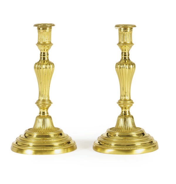 A PAIR OF FRENCH ORMOLU CANDLESTICKS,
