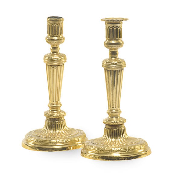 A PAIR OF GILT-METAL CANDLESTICKS,