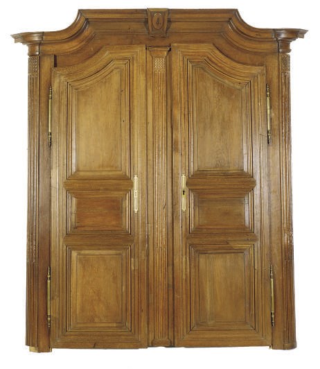 A PAIR OF CONTINENTAL CARVED OAK ARMOIRE DOORS WITH CROWN MOLDING,