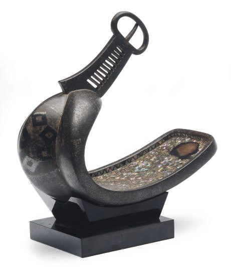 A JAPANESE SILVER AND MOTHER-OF-PEARL STIRRUP ON A STAND,