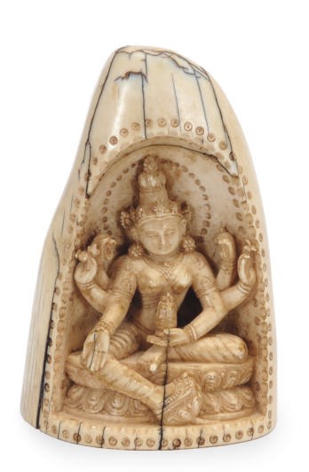 AN INDIAN IVORY CARVED FIGURE OF VASUDHARA,