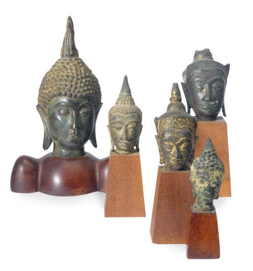 A GROUP OF THIRTEEN SOUTHEAST ASIAN BRONZE SMALL HEADS OF BUDDHA,