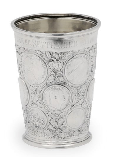 A GERMAN SILVER COIN-INSET BEAKER,