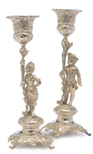 A PAIR OF CONTINENTAL SILVER CANDLESTICK FIGURES OF A GALLANT AND COMPANION,