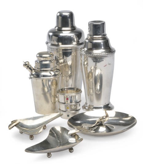 A GROUP OF THREE SILVER COCKTAIL SHAKERS AND A JIGGER,