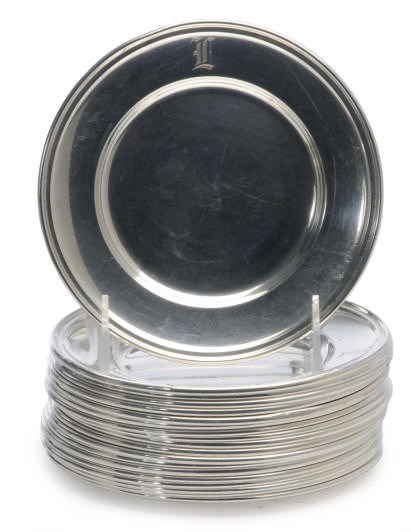 AN ASSEMBLED SET OF NINETEEN AMERICAN SILVER BREAD PLATES,