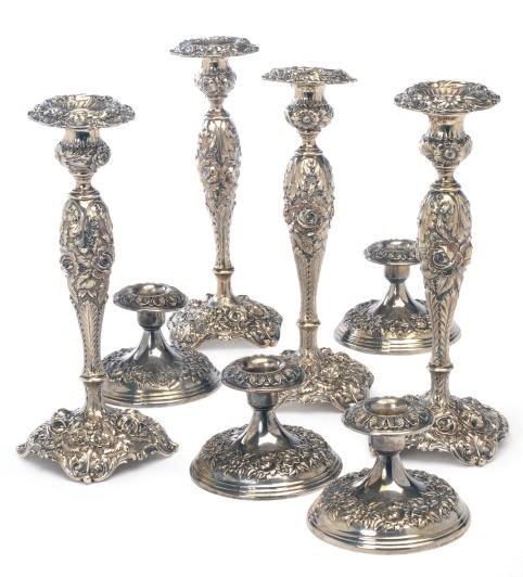A SET OF FOUR AMERICAN SILVER HIGH CANDLESTICKS AND FOUR LOW CANDLESTICKS,