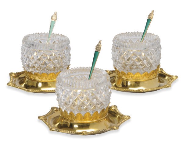 A SET OF EIGHT GILT-METAL MOUNTED AND CUT GLASS PRESERVE POTS AND FOUR AMERICAN SILVER GILT AND ENAMELED CONDIMENT SPOONS,