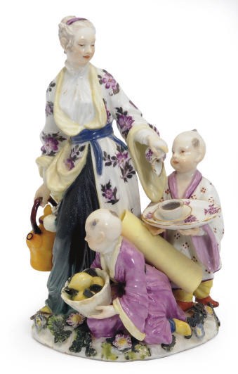 A GERMAN PORCELAIN FIGURE GROUP OF A CHINESE WOMAN AND TWO CHILDREN TAKING TEA,