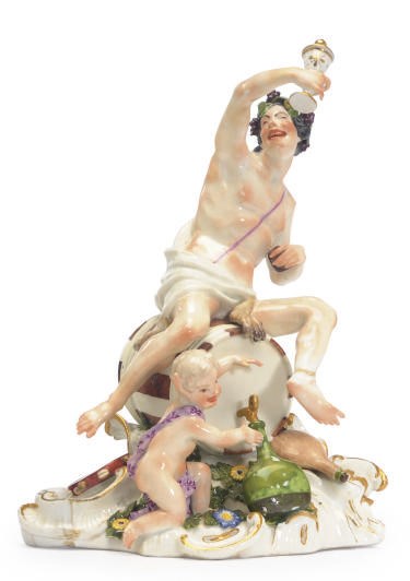 A GERMAN PORCELAIN MODEL OF BACCHUS,