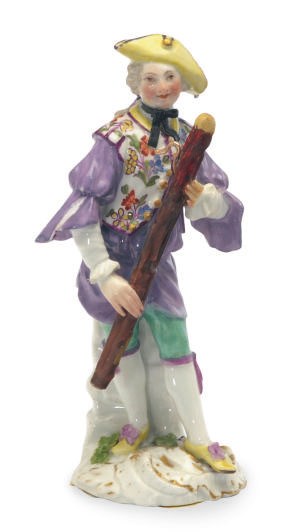 A GERMAN PORCELAIN MODEL OF A BASSOON PLAYER,
