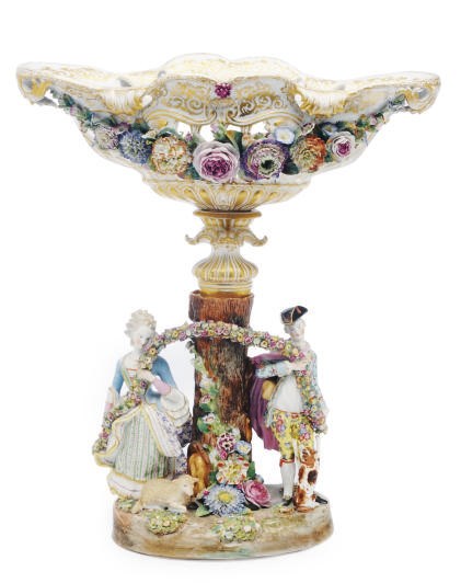 A MEISSEN STYLE PORCELAIN FLOWER-ENCRUSTED RETICULATED BASKET ON AN ASSOCIATED STAND AS GALLANT AND COMPANION,