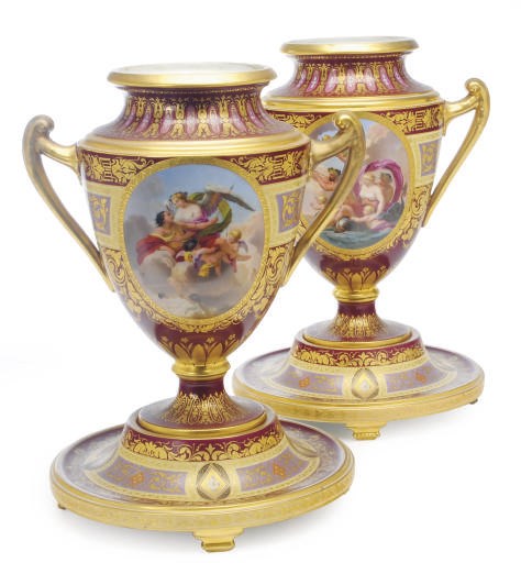 A PAIR OF VIENNA STYLE CLARET GROUND SHIELD-SHAPED VASES AND STANDS,