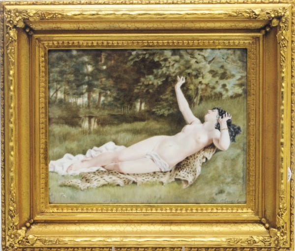A FRENCH PORCELAIN PLAQUE OF A RECLINING WOOD NYMPH,