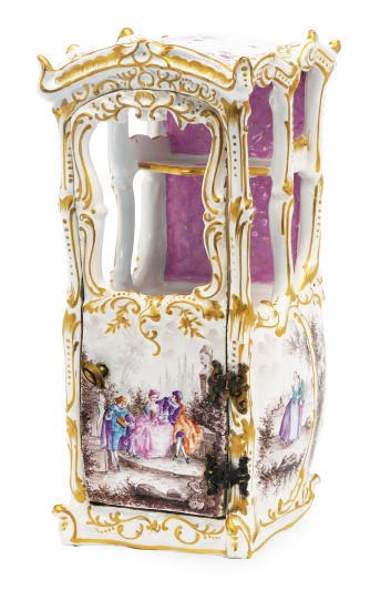 A CONTINENTAL FAIENCE MODEL OF A SEDAN CHAIR,