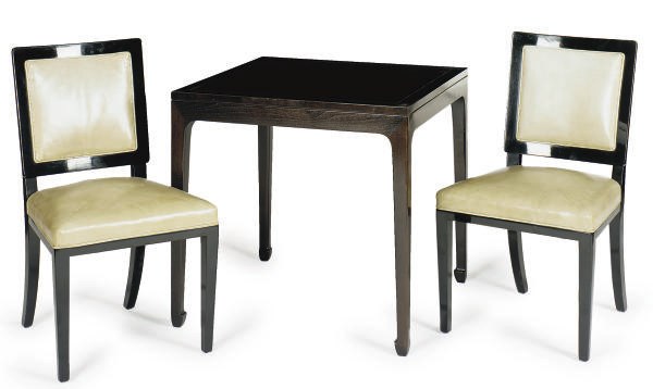 AN EBONIZED GAMES TABLE AND FOUR CHAIRS,