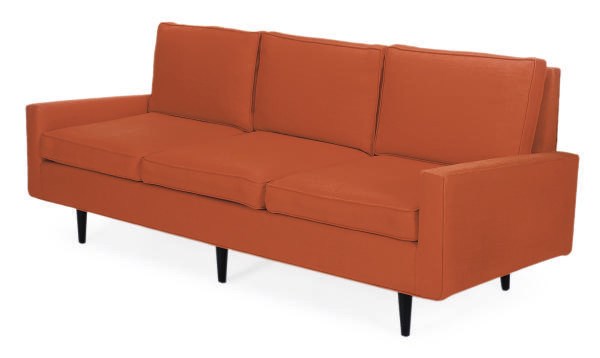 AN EBONIZED AND UPHOLSTERED SOFA,