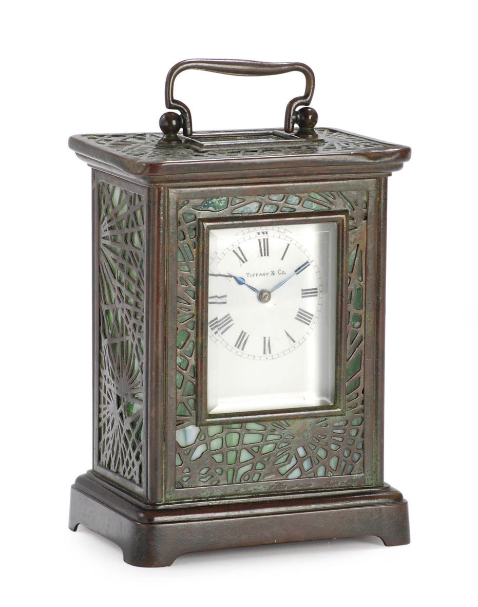 A PATINATED BRONZE AND 'FAVRILE' GLASS 'PINE NEEDLE' CLOCK,