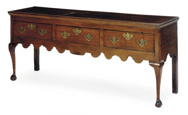 A GEORGE II OAK SERVING TABLE,