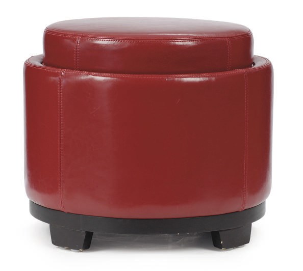 A RED LEATHER AND EBONIZED CIRCULAR LOW STOOL,