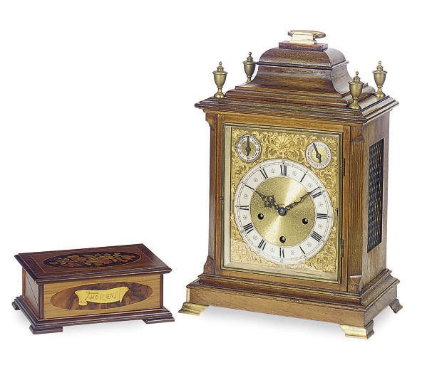 A GERMAN WALNUT MANTEL CLOCK,
