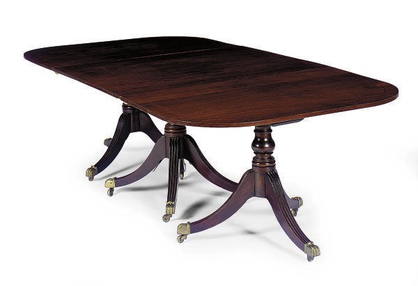 A MAHOGANY TRIPLE-PEDESTAL DINING TABLE,