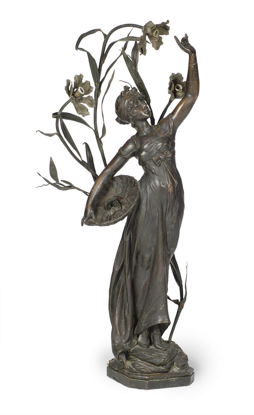 A PATINATED METAL FIGURAL TORCHERE,