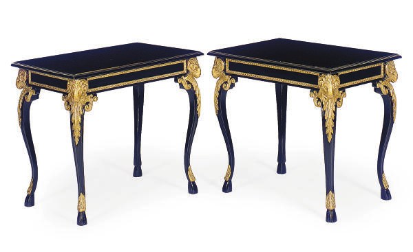A PAIR OF EBONIZED AND PARCEL-GILT SIDE TABLES,