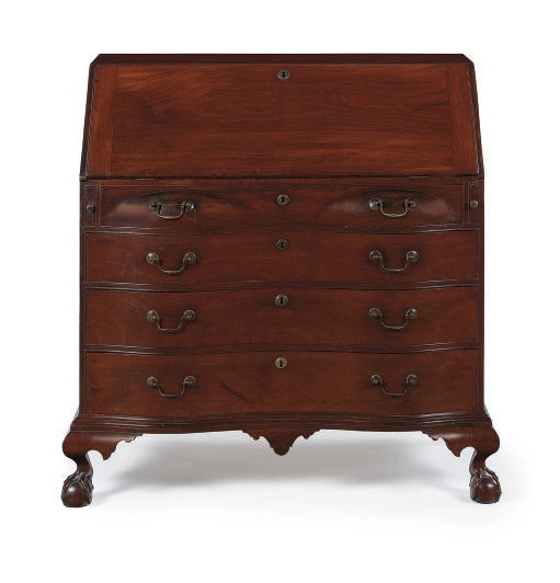 A CHIPPENDALE MAHOGANY REVERSE-SERPENTINE SLANT-FRONT DESK,