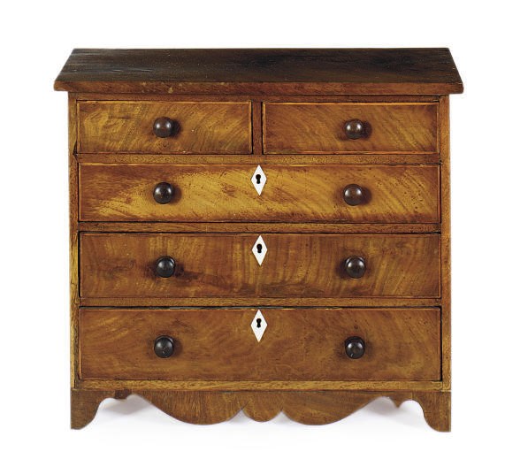 A LATE GEORGE III MAHOGANY MINIATURE CHEST-OF-DRAWERS**,