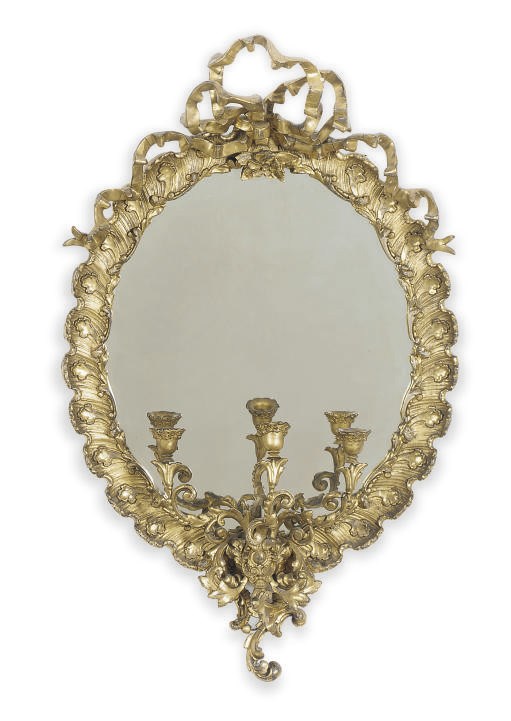 A CONTINENTAL GILT-COMPOSITION GIRANDOLE MIRROR,