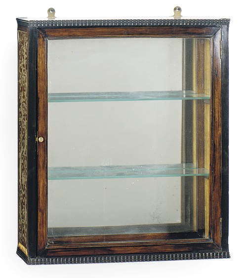 A CONTINENTAL ROSEWOOD, EBONY AND PEWTER HANGING CABINET**,