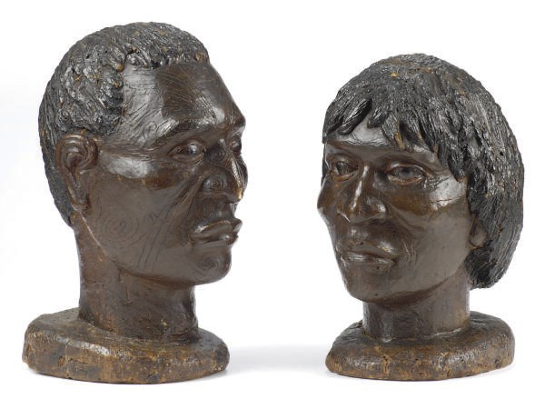 TWO CARVED AND PAINTED FIGURE HEADS,