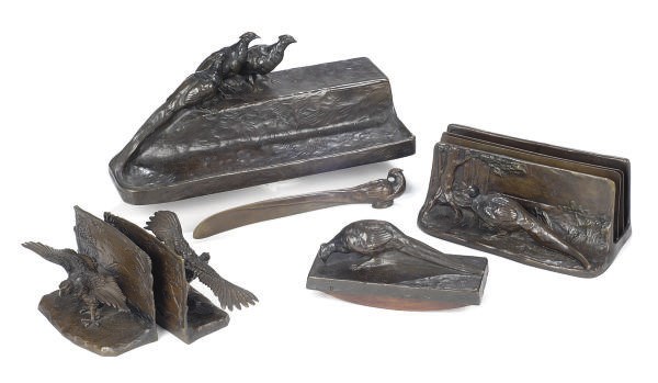 AN AUSTRIAN PATINATED BRONZE FIGURAL DESK SET,