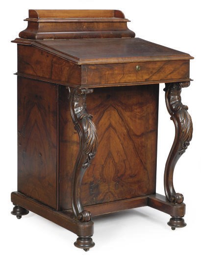 AN EARLY VICTORIAN WALNUT DAVENPORT**,