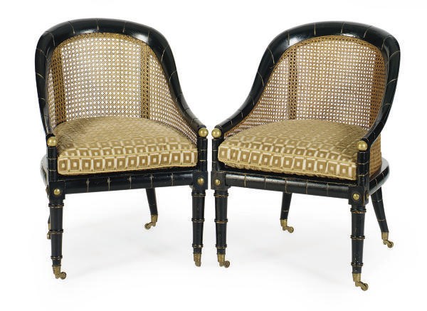 A PAIR OF EBONIZED AND CANED BERGERES,